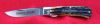 #735108 TIDIOUTE CUTLERY, LINER LOCK, BURNT CARVED STAG BONE. RELEASED: 5 26, 2008