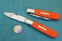 #781124 TIDIOUTE CUTLERY, ROZEE BARLOW, JIGGED ORANGE DELRIN. 1095 CARBON STEEL.